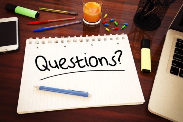 questions written on a notebook depicting boiler vs. furnace FAQs
