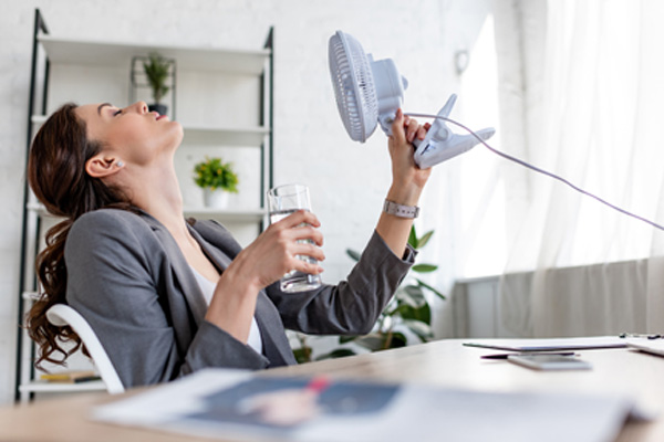 image of a woman dealing with a broken AC