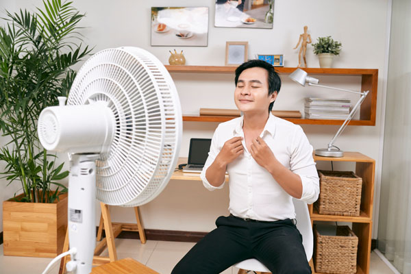 image of a man who has a broken air conditioner