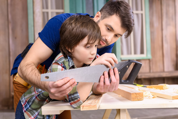 father and son working in garage