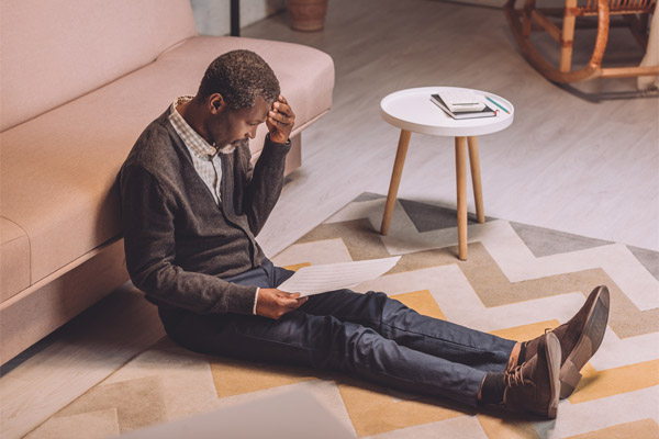 image of a man looking at his cooling costs