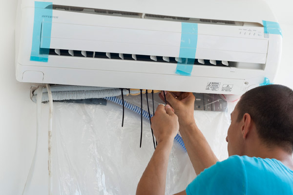 image of hvac contractor installing ductless heat pump