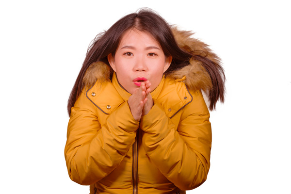 image of girl with blanket due to uneven heating in house