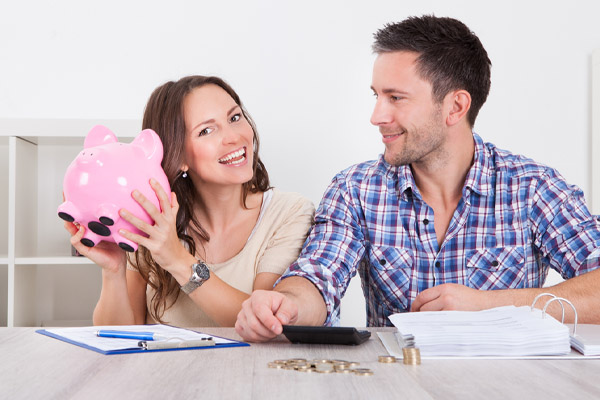 image of a happy couple saving money after due to using bioheat heating oil