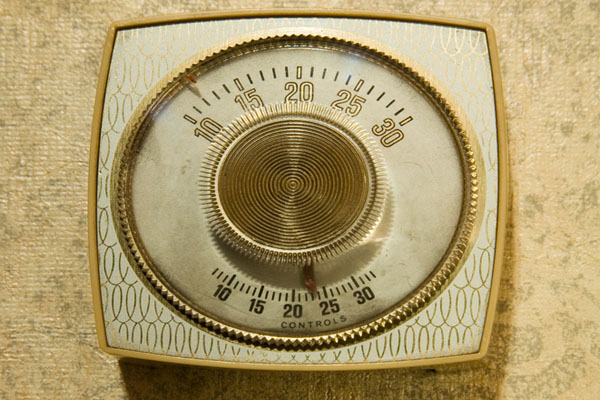image of an old manual thermostat