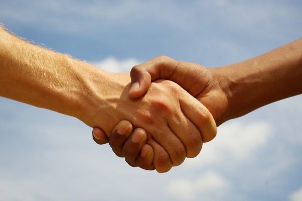 image of hands shaking depicting professionalism of hvac contractor