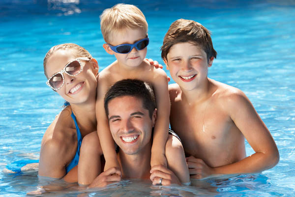 image of family playing in pool