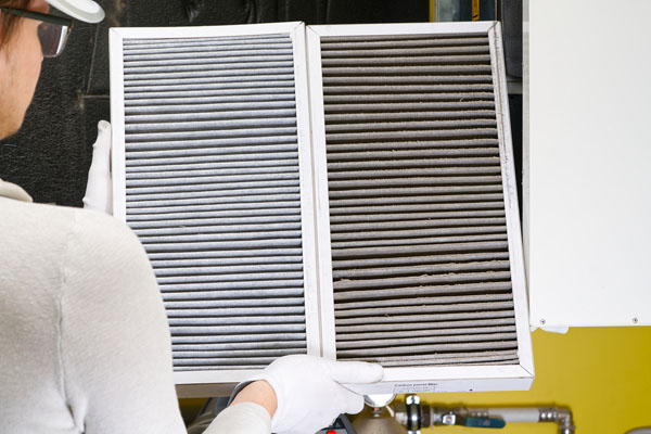 home air filter replacement new and old hvac filter next to each other