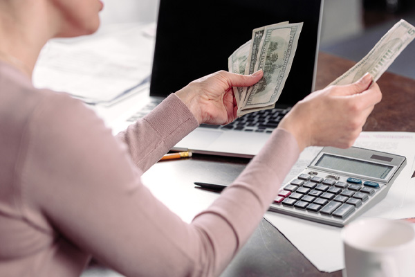 image of a couple calculating air conditioning costs depicting overcharged air conditioner