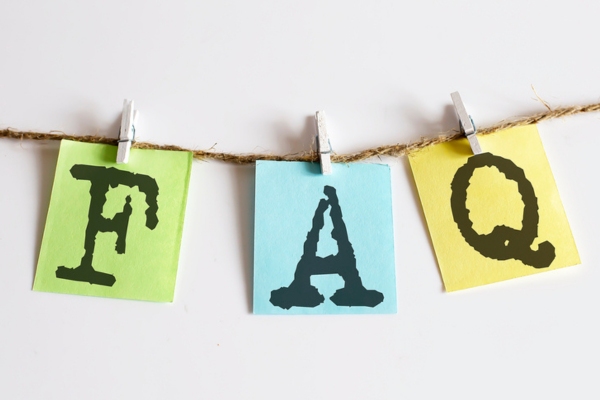 FAQ written on colored paper clipped on a thin rope depicting questions about Ductless Mini-Split Lifespan