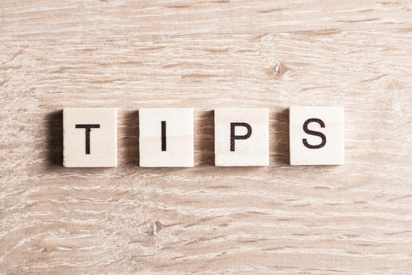 TIPS spelled using wooden letter chips depicting ductless mini-split maintenance