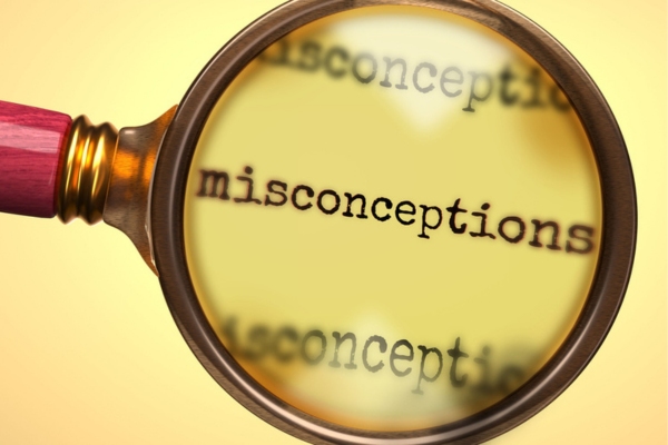 misconceptions word highlighted by a magnifying glass depicting HVAC Services