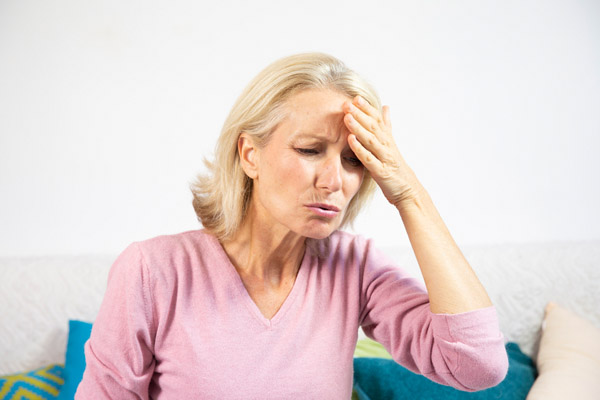 woman feeling sick due to poor indoor air quality