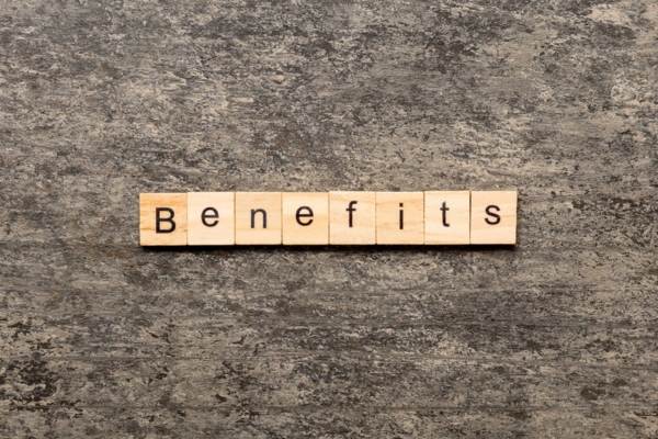 Benefits spelled using wooden letter chips depicting switching to new air conditioner unit