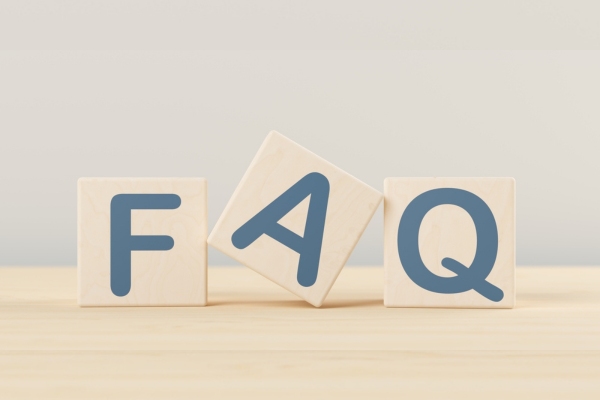 FAQ spelled using wooden letter cubes depicting questions about old air conditioners