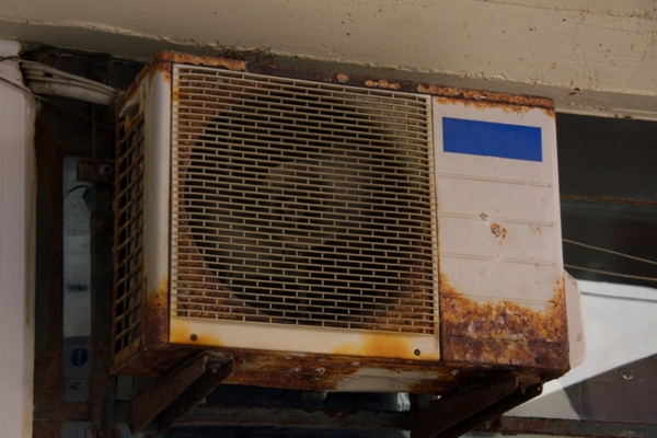 old and rusty outdoor air conditioner unit
