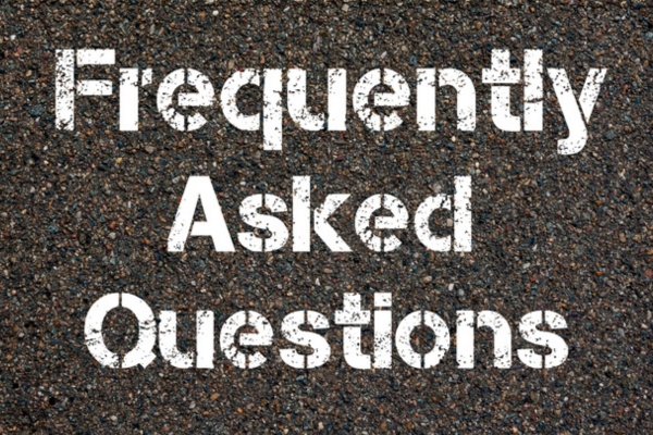 Frequently Asked Questions spray painted on concrete depicting FAQs about home air sealing