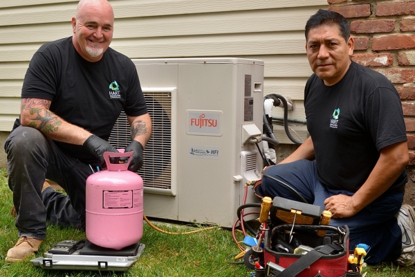 Hart Home Comfort HVAC technicians performing HVAC maintenance for a client Hart Home Comfort HVAC technicians performing HVAC maintenance for a client