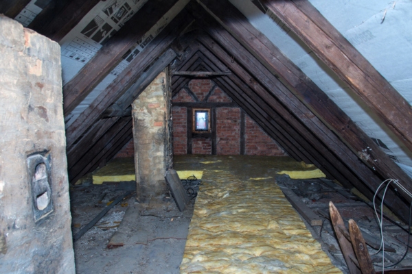 image of an attic of an old house depicting places that require air sealing