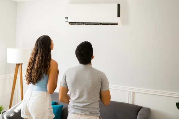 couple looking at ductless system at home