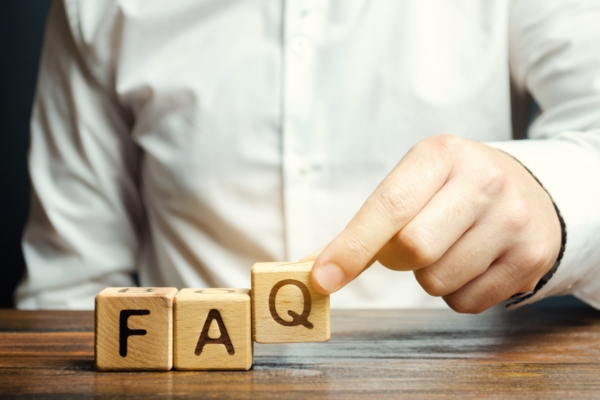 FAQ spelled using wooden letter cubes depicting questions about Why Is My AC Struggling to Keep Up