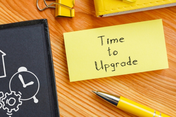 Time to upgrade text on a yellow sticky note depicting AC upgrade