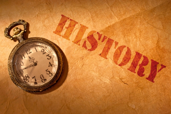 antique watch with history written on brown paper