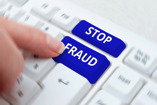 Stop Fraud written on keyboard keys depicting Air Conditioning Scams