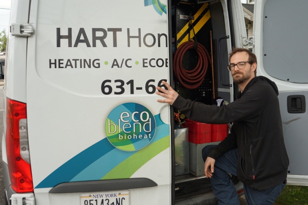 Hart Home Comfort professional HVAC technician and service van