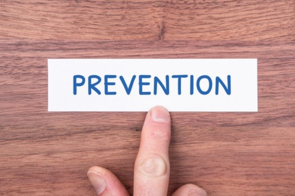 PREVENTION word written on a small paper depicting Preventing Air Conditioning Sickness