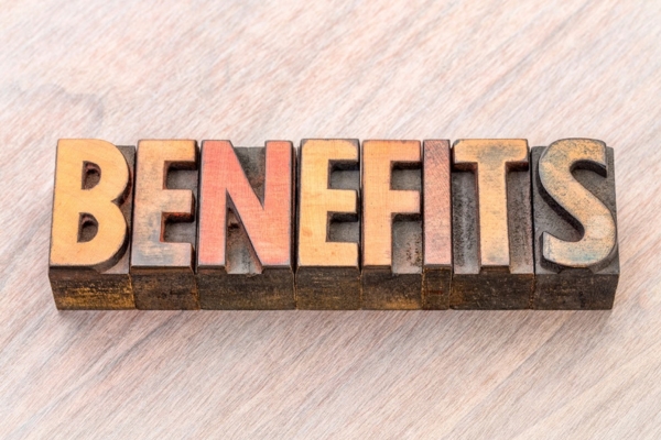BENEFITS spelled using wooden letterpress depicting Choosing a Local Heating Oil Supplier