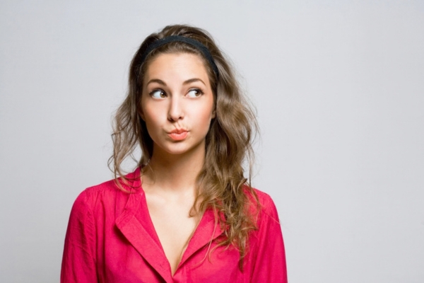 woman looking away while thinking depicting Choosing a Local Heating Oil Supplier