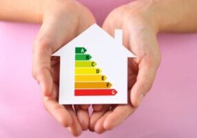 Paper house with energy efficiency chart depicting heating oil