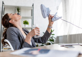 image of a woman dealing with a broken AC