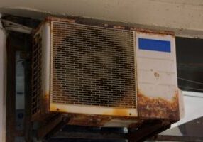 old and rusty outdoor air conditioner unit