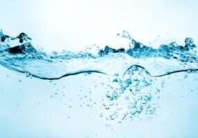 splash of water with bubbles depicting water in oil tank